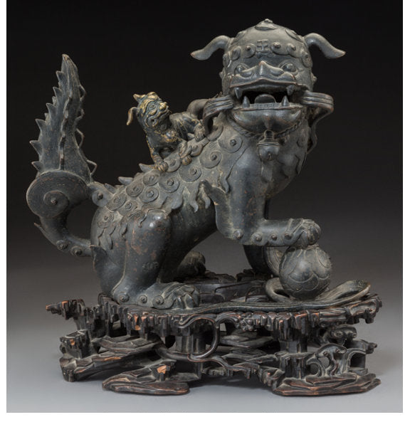 A Chinese Bronze Foo Lion Censer on Rosewood Stand, Qing Dynasty