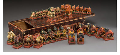 A Mongolian Polychromed Wood Figural Chess Set